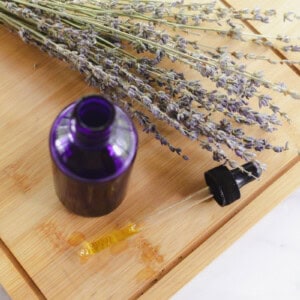 A homemade hair moisturizing oil on a vanity.