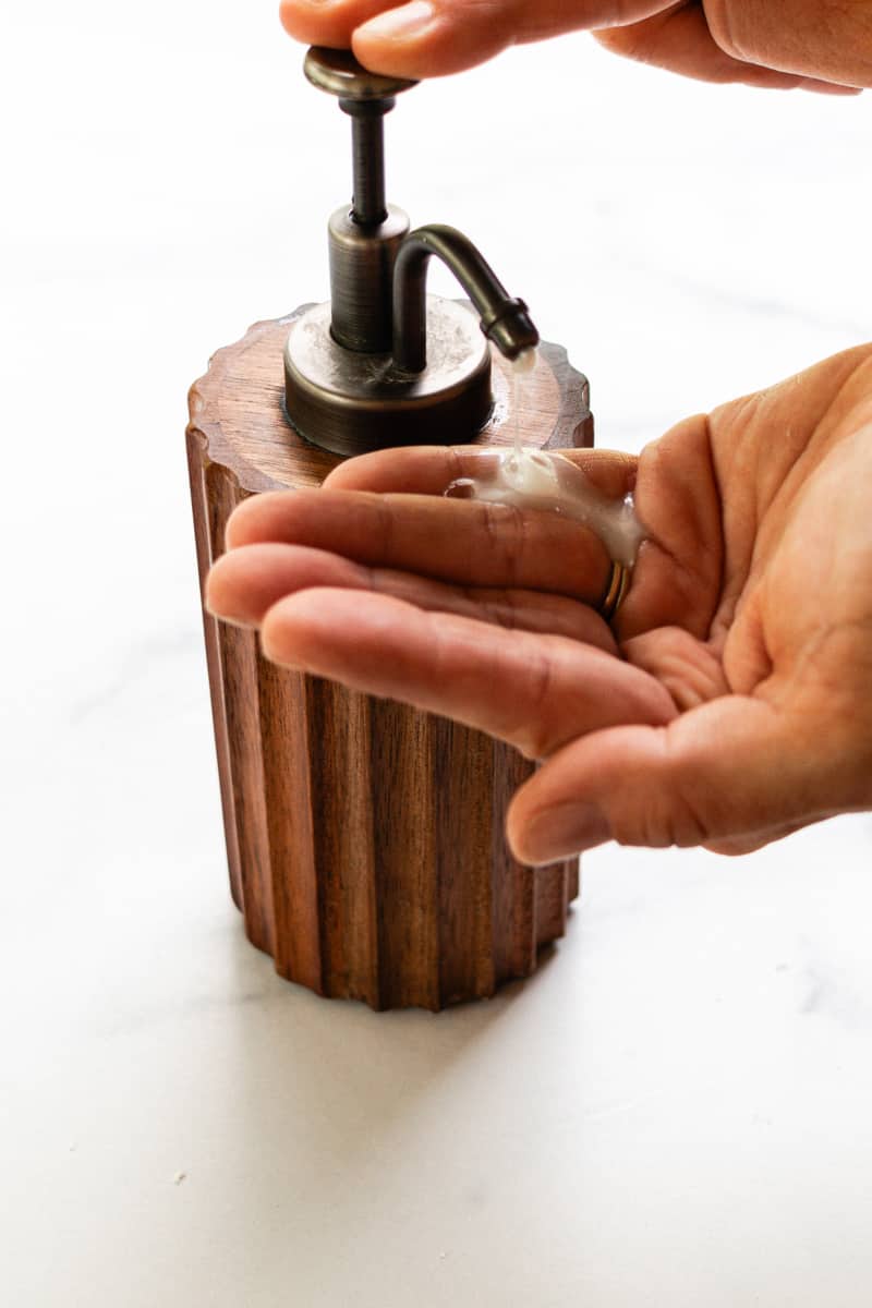 Homemade liquid soap made from a solid soap bar being dispensed.