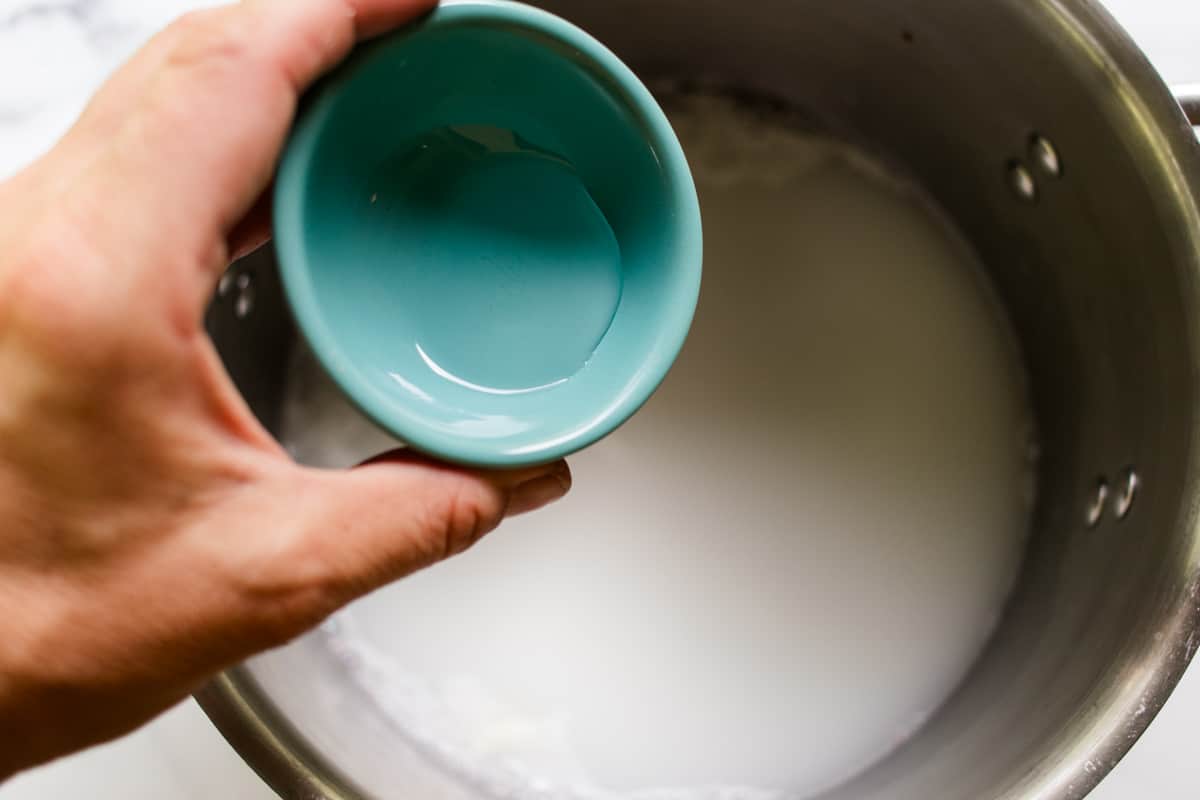 Pouring vegetable glycerin into the melted soap.