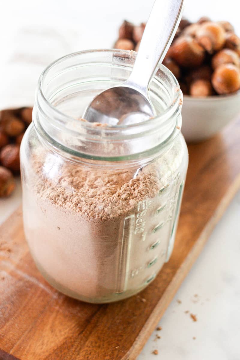 Storing the laundry detergent in a clear container.