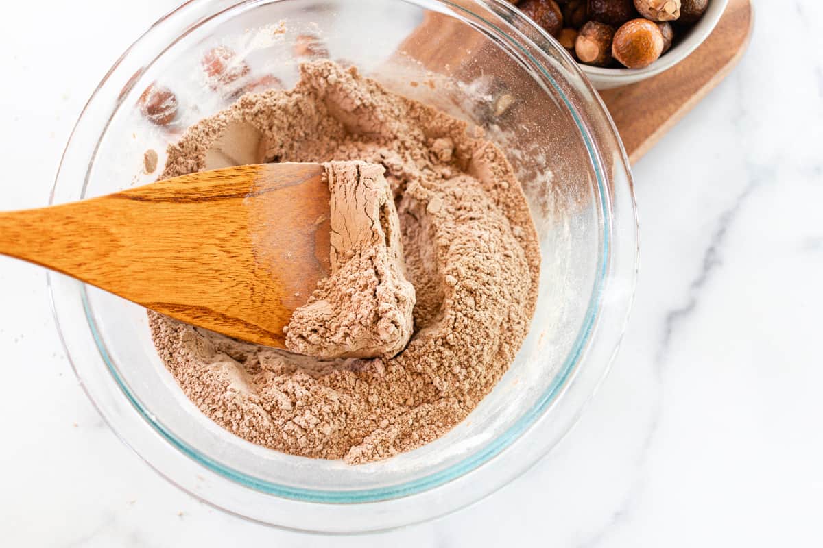 Adding soap nut powder to a mixing bowl.