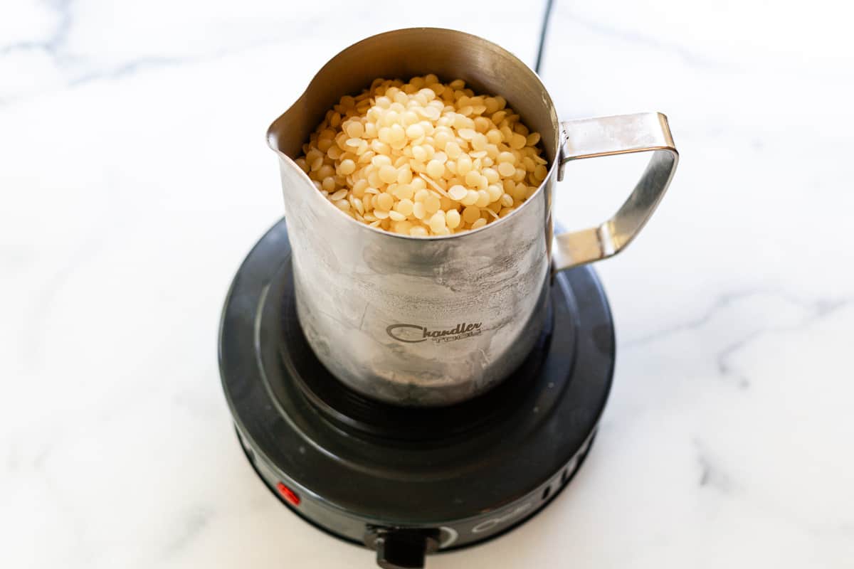 Melting wax in a wax melter.