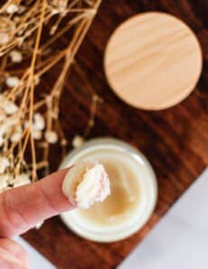 Applying a diy cleansing balm with my fingertips.