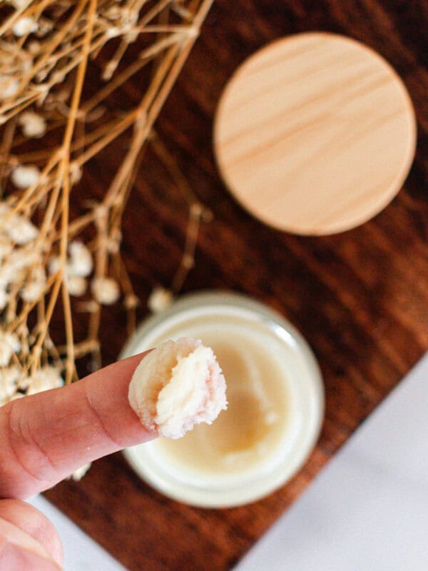 Applying a diy cleansing balm with my fingertips.