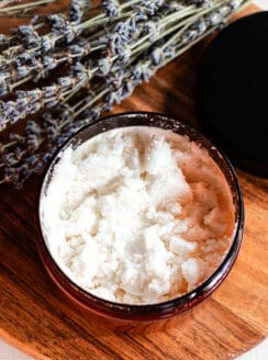 Coconut milk bath ingredients in a small bowl on a bathroom vanity.