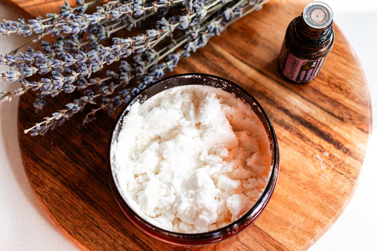 Powdered coconut milk in a bowl with skin loving ingredients.