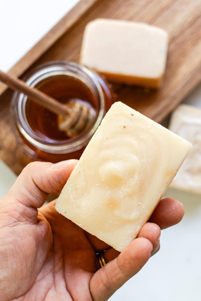 Grabbing a honey soap bar to use for a hand soap .