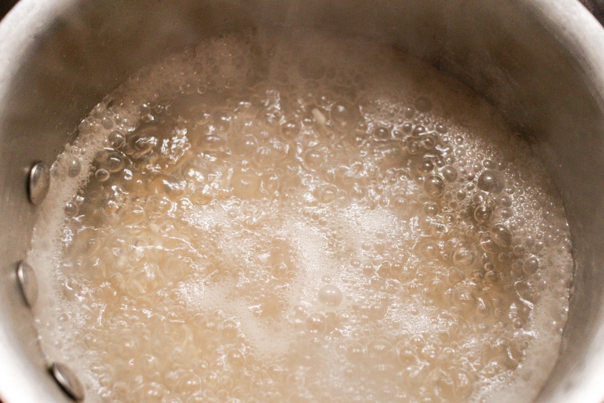 Boiling the rice for the hair treatment.