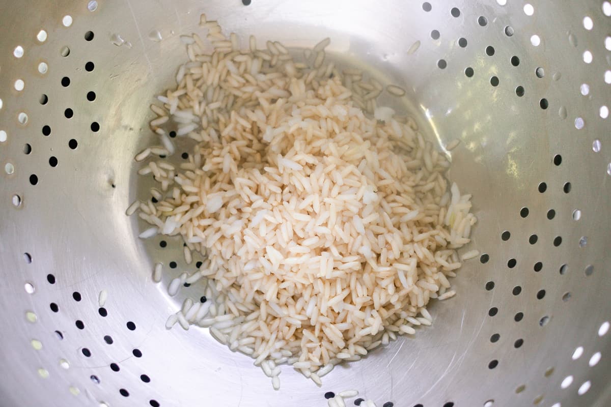 Straining the rice.