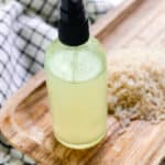 Rice water for hair in a small spray bottle.