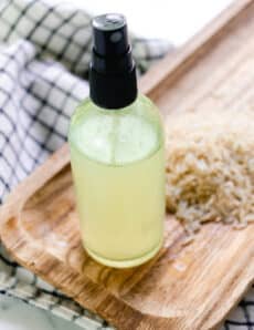 Rice water for hair in a small spray bottle.