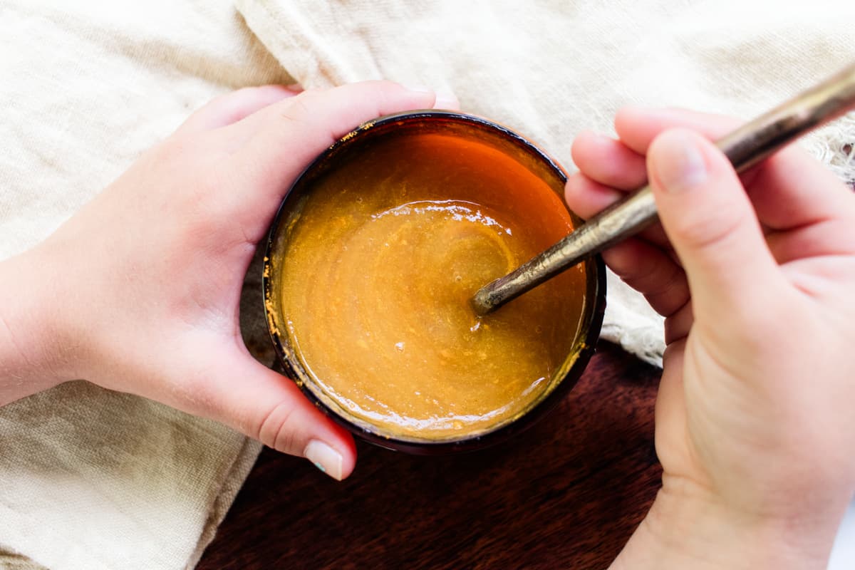 Stirring in the honey.