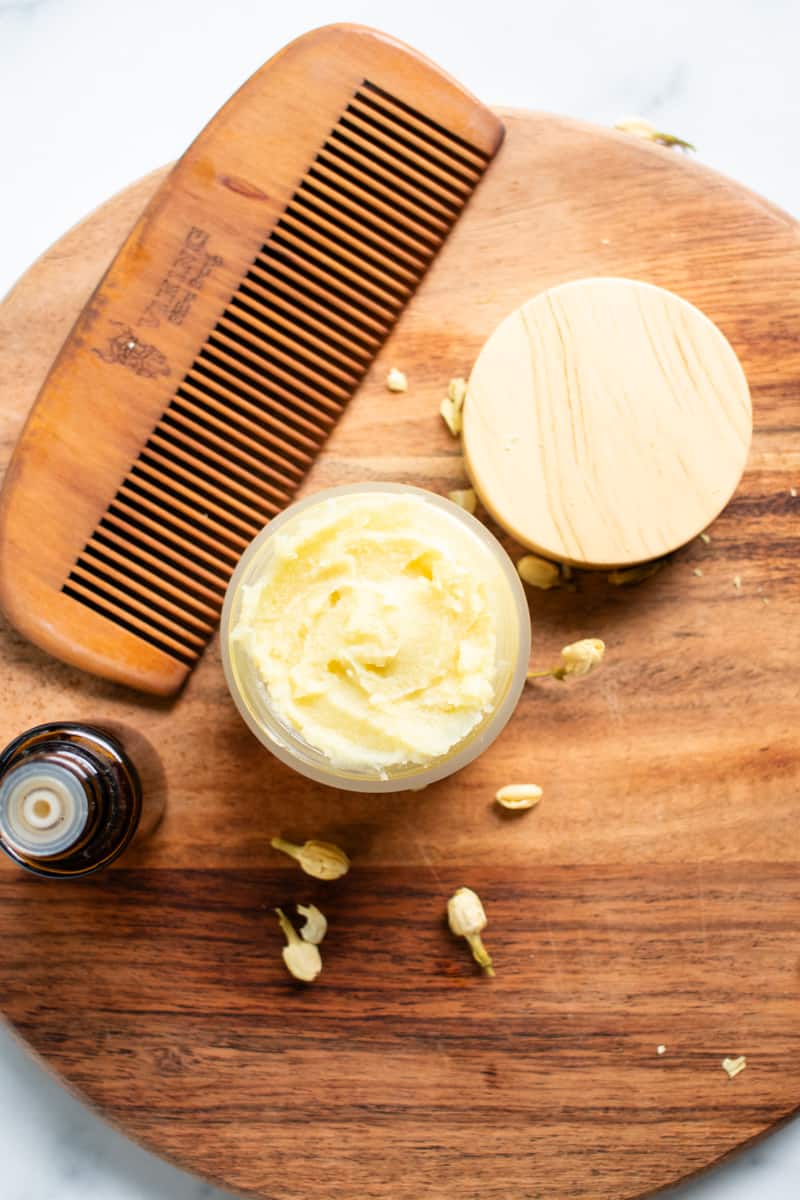 Getting ready to use a little DIY beard butter and then comb it through the hair with a wooden comb.