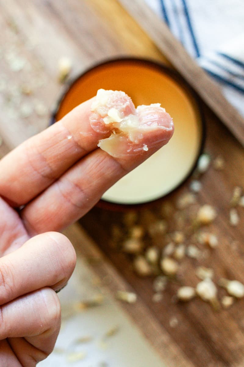 Applying tallow balm to the skin.