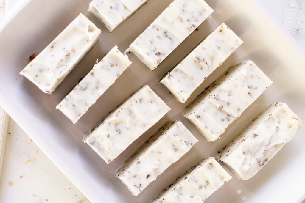 10 herbal soap bars curing on their ends.