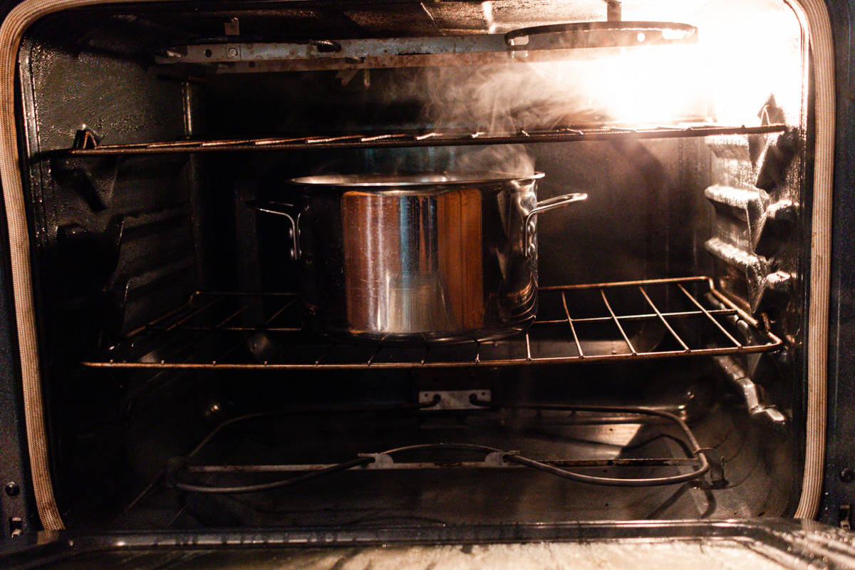 Steaming an oven with a boiling pot of water.