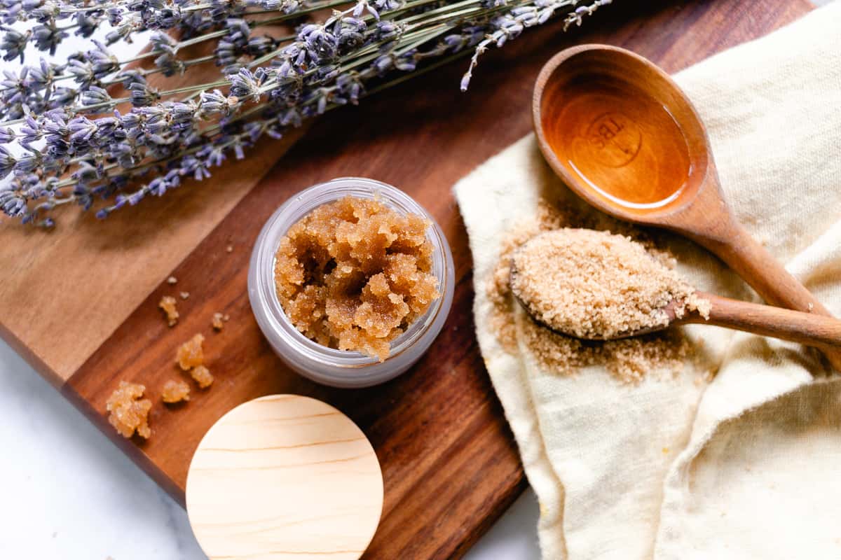 All the ingredients to make a underarm exfoliator on a wooden board.