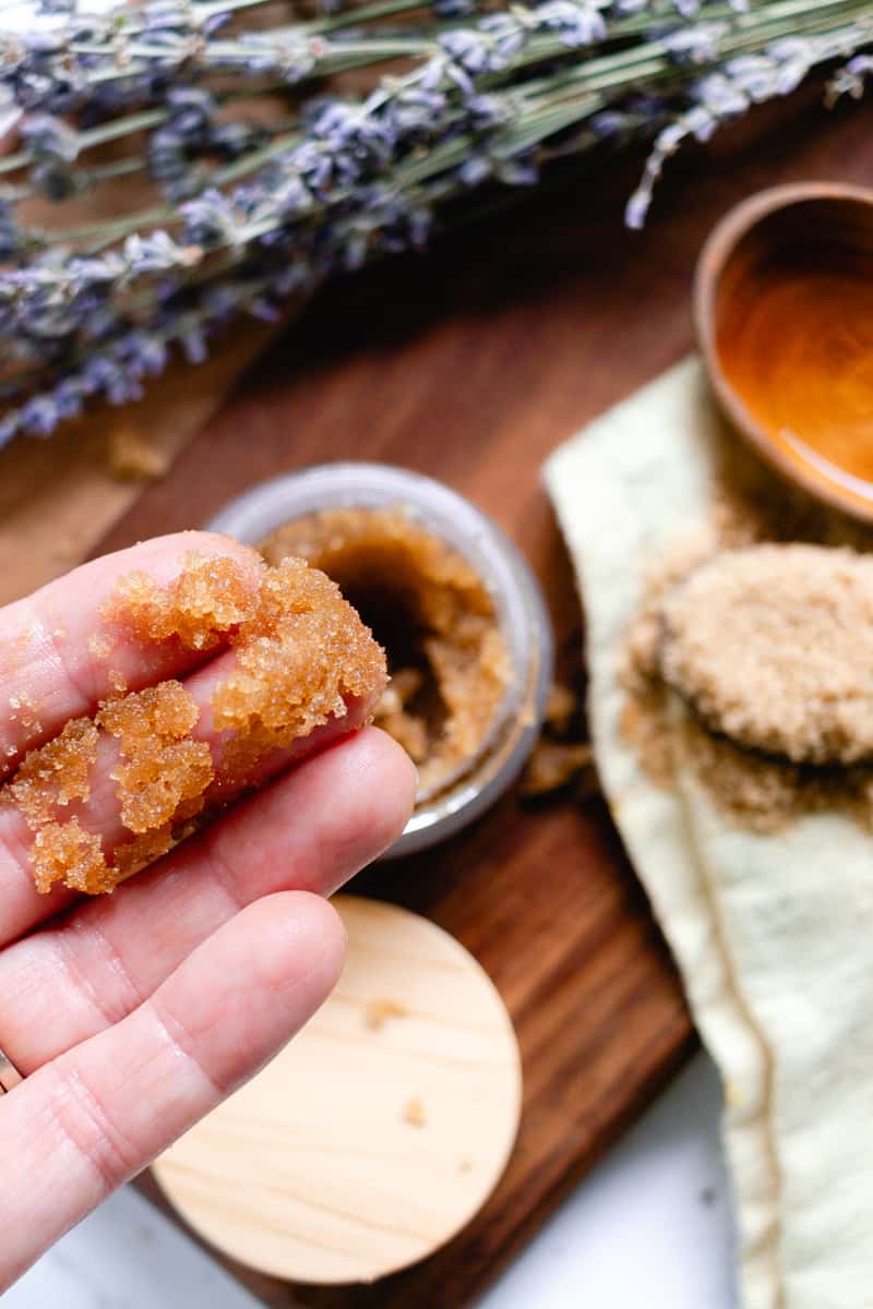 Applying brown sugar armpit exfoliator to the underarms.