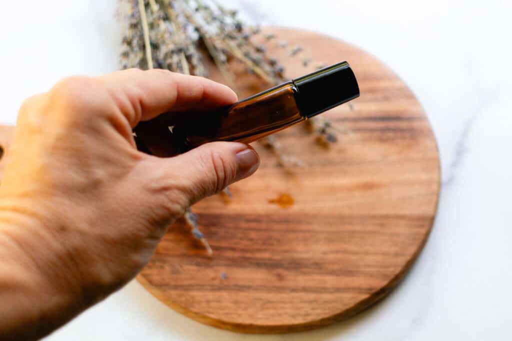 Shaking the roller bottle before using.