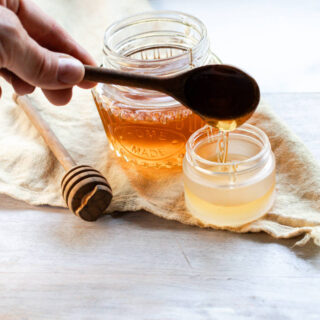 Adding honey to the hydrating lip mask recipe.