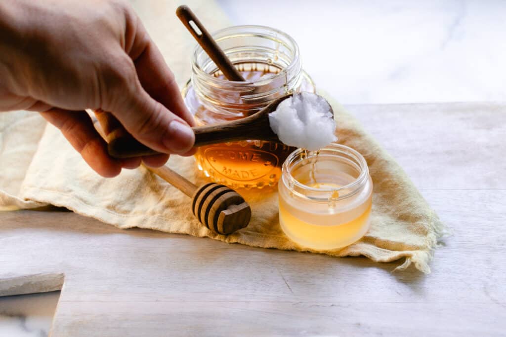 Adding coconut oil to the lip mask.