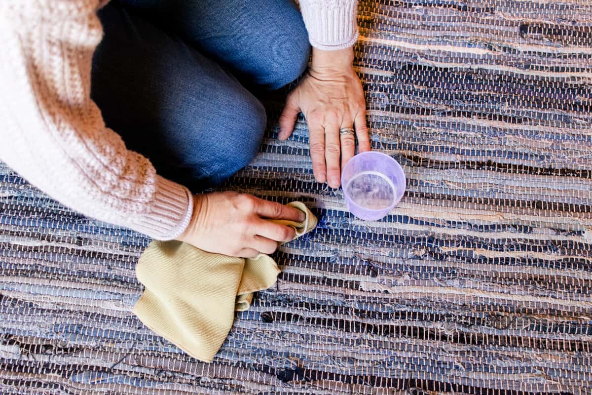 Blotting the stain with a clean cloth.