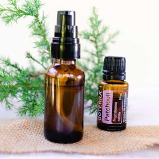 DIY patchouli cologne in a glass spray bottle.