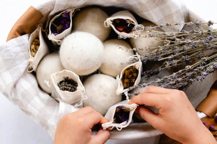 Scenting wool dryer balls with dried herbs in breathable muslin bags.