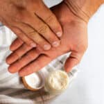 Applying beard balm to the palms of my hands.