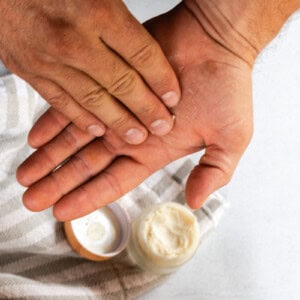 Applying beard balm to the palms of my hands.