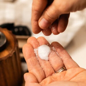 Spreading epsom salts onto my hair conditioner.