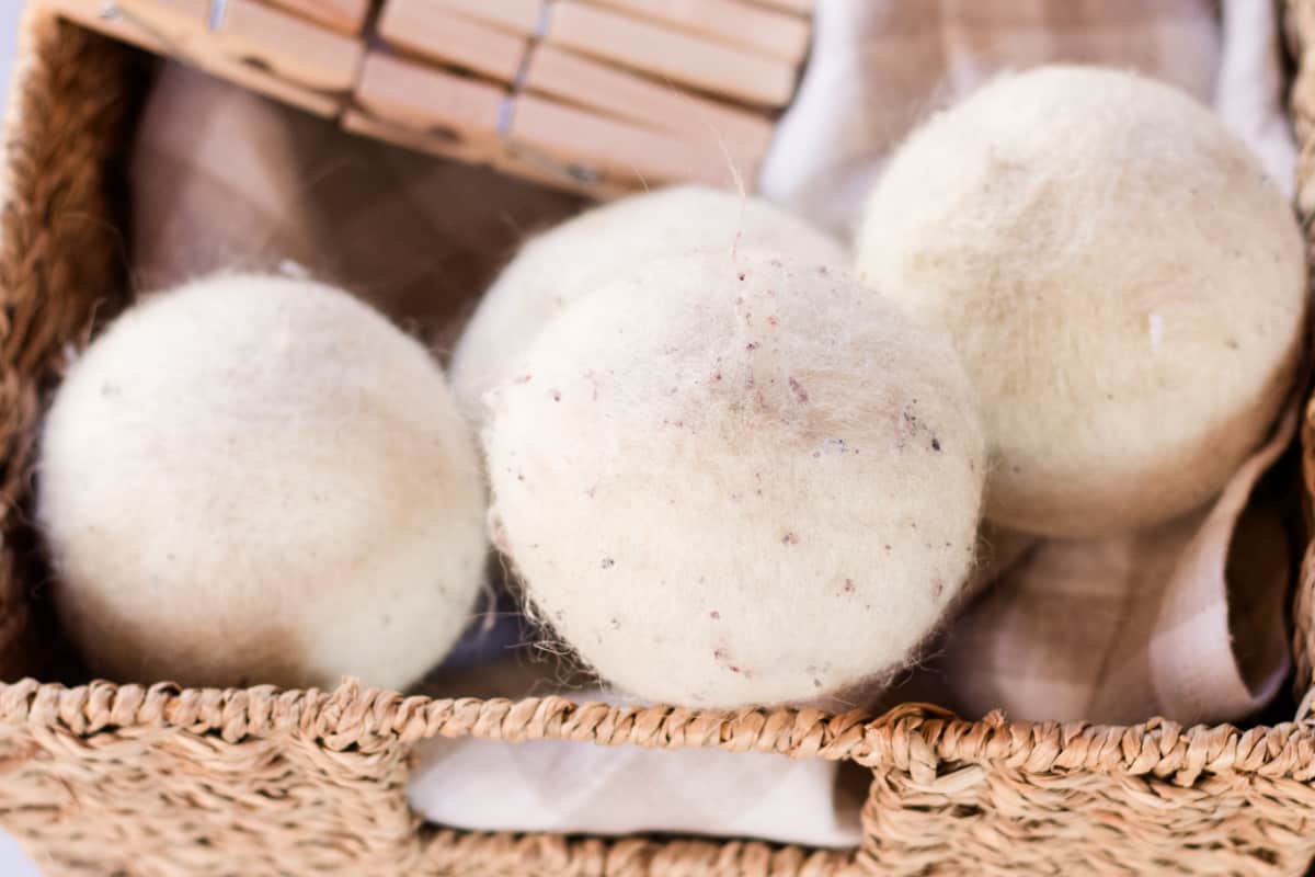 A close up shot of a few well used dryer balls airing out after washing them on the washing machine.