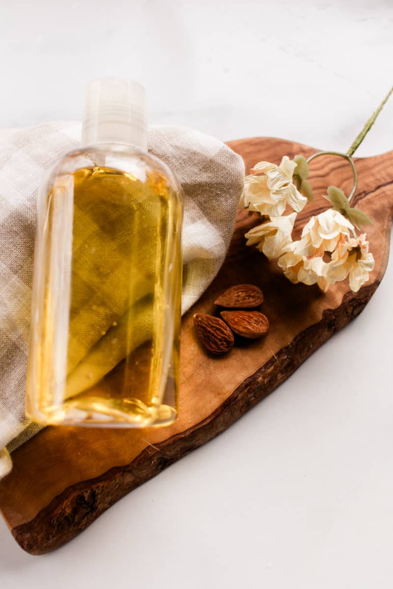A moisturizing shower oil in a clear bottle made up of hydrating oils.