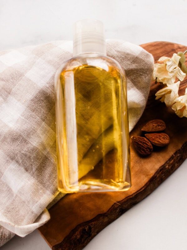 Homemade shower oil in a clear heavy duty plastic bottle.