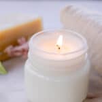 A burning soy wax candle.