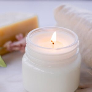 A burning soy wax candle.