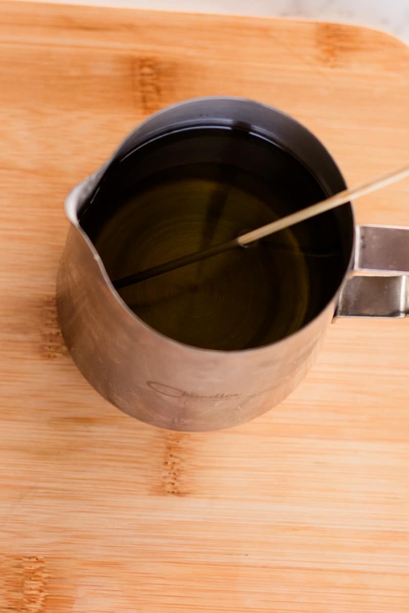 Stirring in the fragrance oils into the melted wax.