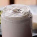 Homemade hair butter in a glass jar.