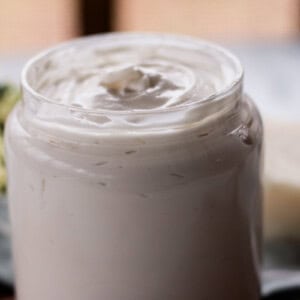 Homemade hair butter in a glass jar.