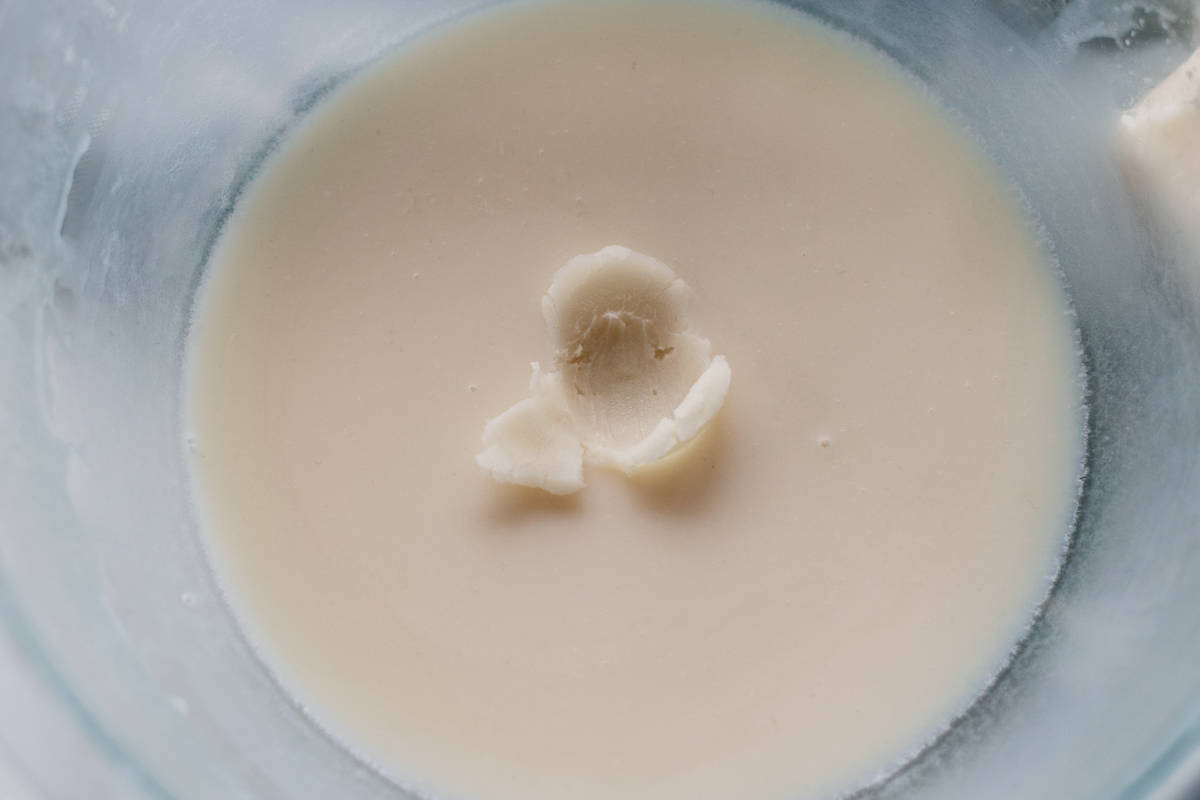 Checking the texture of the hair butter.