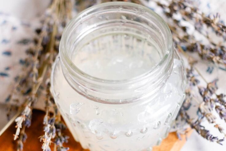 DIY hair gel made with gelatin in a glass jar with dried lavender sprigs.