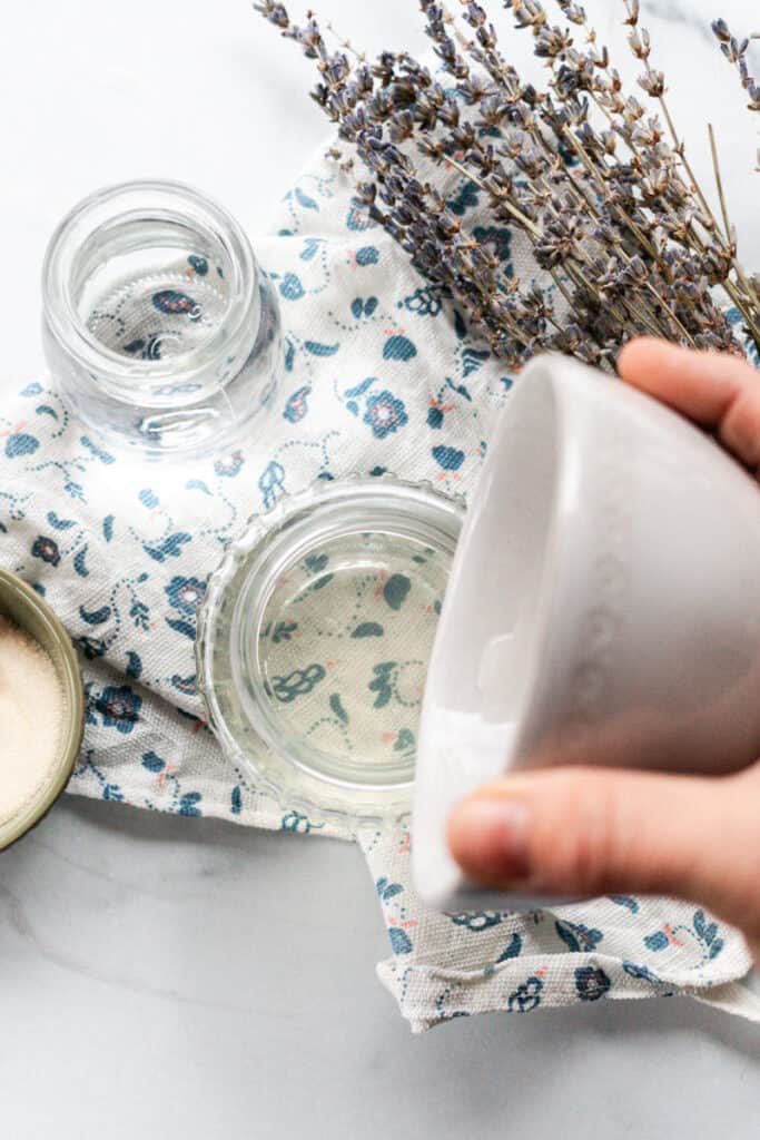 Pouring the gel into a small container.