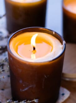 A homemade massage candle flickering in the evening light.