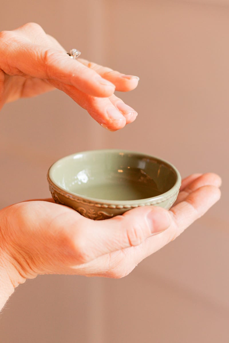 Dipping the tips of my fingers into the hair mask.