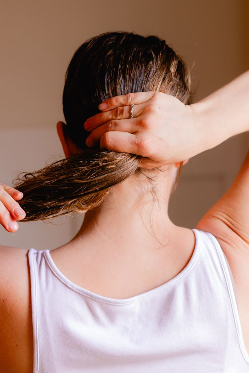 Working more of the hair mask onto the tips of my hair.