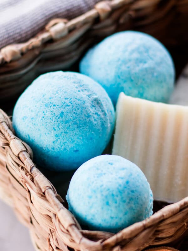 Homemade blue shower bombs being stored in a wicker basket.
