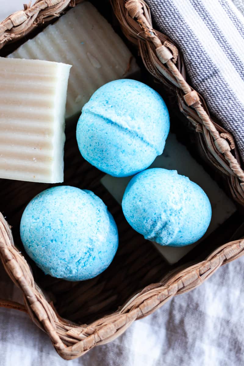 Blue dyed shower bombs being stored in a basket.