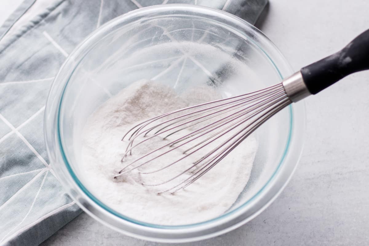 Whisking the dry shower bomb ingredients together.