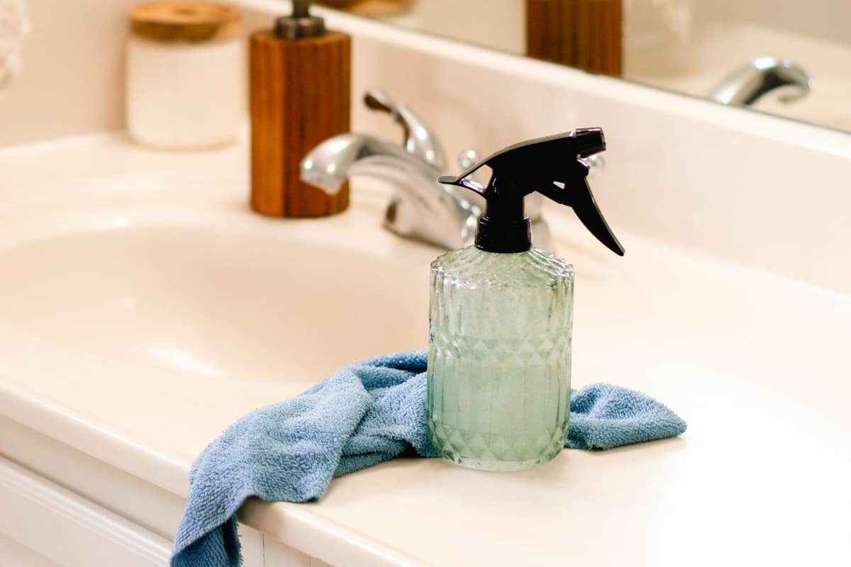 A homemade soap scum spray on a bathroom sink after it has been cleaned.