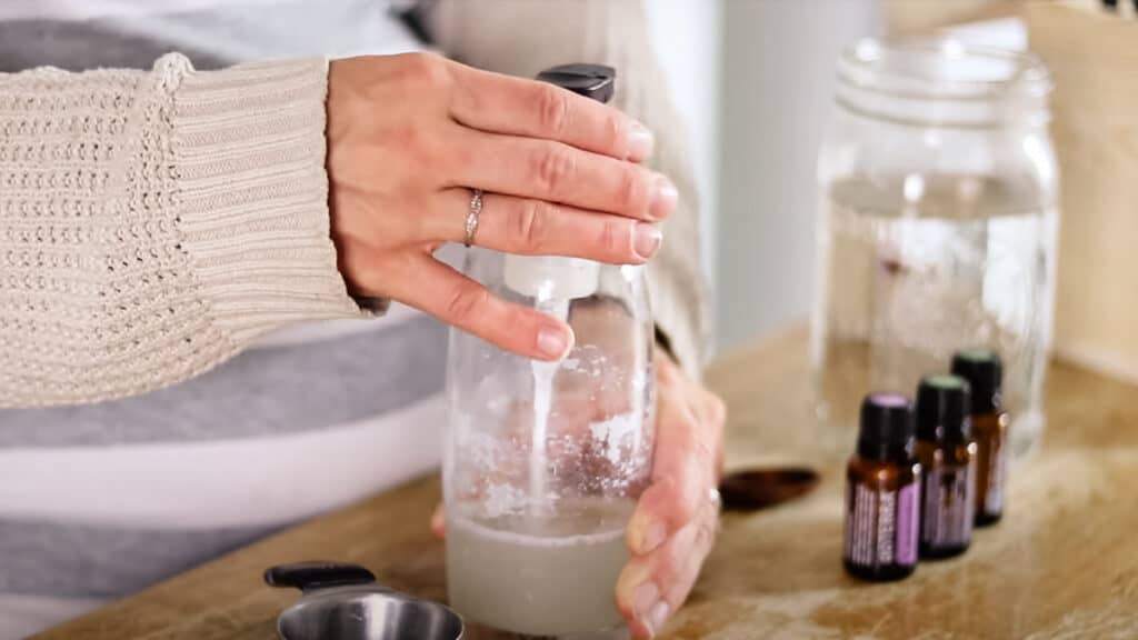 Securing the lid tightly and shaking it well.